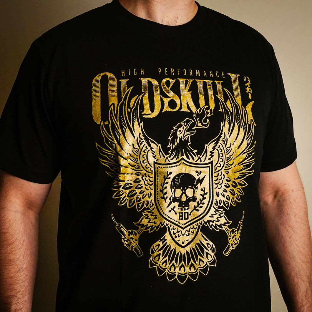 This shirt comes in yellow gold, black or white. It has a eagle emblem with a shield in the center containing a skull with lightning through it. The brand name Oldskull Shirts is written above it in bold print. This is a streetwear vintage style of shirt made of the coolest design by Oldskull Store USA the best in North America.