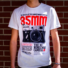 Load image into Gallery viewer, The Photographer Camera Shirt shows where it all started. Your not just someone using an camera phone for selfies. You have the eye, the vision for the perfect shot. You move in and push the subject out of dead center. You shoot on manual. You shoot in RAW. You&#39;re a true photographer. Experience the OldSkull Shirts quality. -OldSkull Store USA the best shirt store in North America.